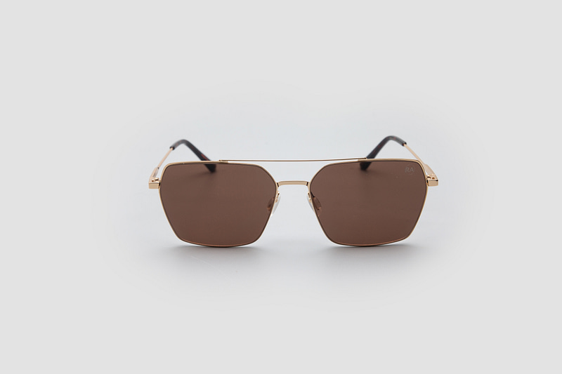 A pair of brown-tinted, square-framed aviator sunglasses with a gold-tone metal frame against a white background.